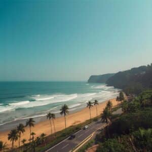 Scenic Konkan coastline with golden sand beach, coconut trees, turquoise Arabian Sea waves, and peaceful sunny sky Konkan Captions for Instagram